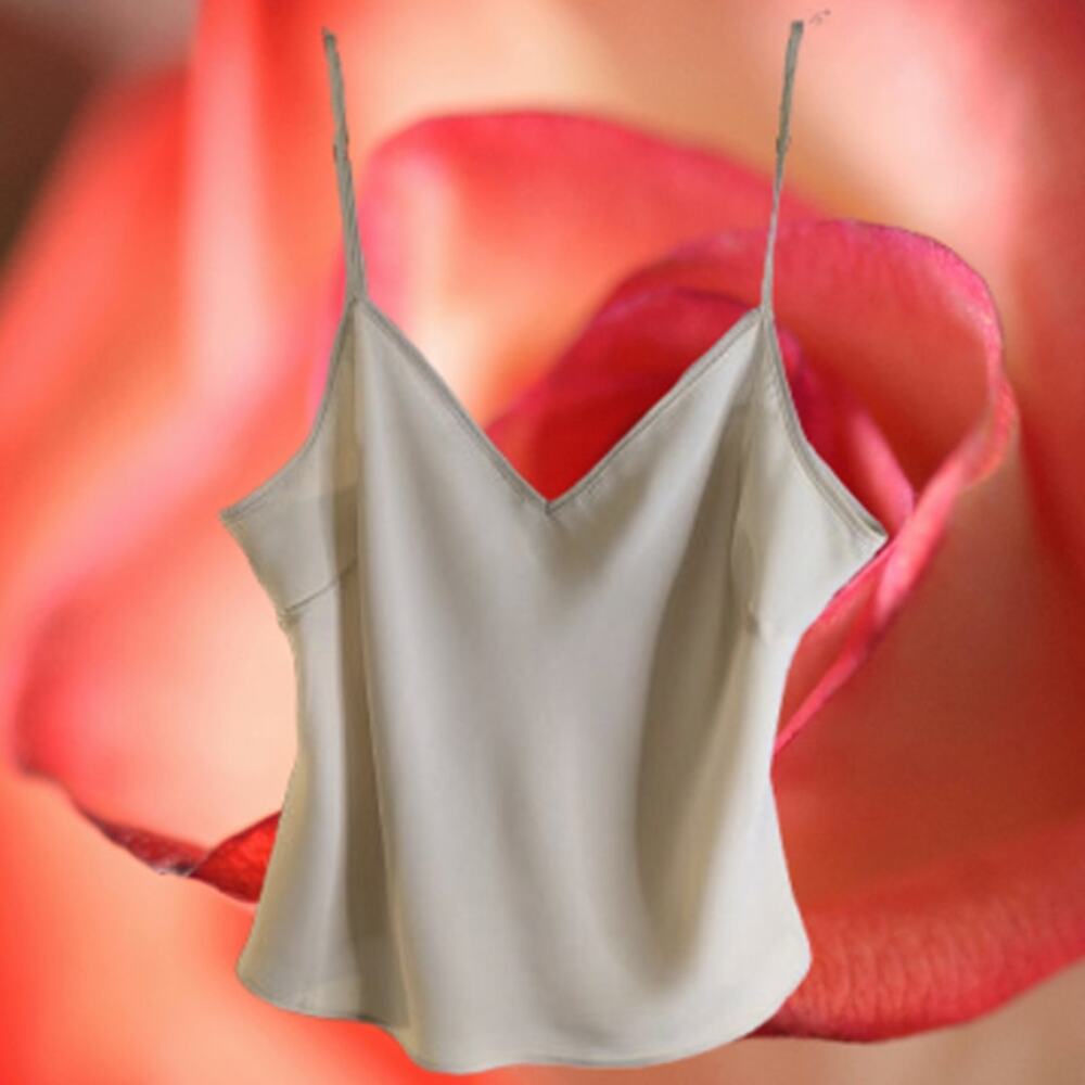 Large ivory cami with adjustable straps.